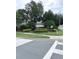 Community entrance sign surrounded by colorful landscaping, welcoming residents and visitors at 1914 Sassafras Dr, Wesley Chapel, FL 33543