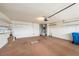 A large garage with ample storage and shelving at 1914 Sassafras Dr, Wesley Chapel, FL 33543