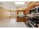 Open kitchen design with stainless appliances, a breakfast bar, and ample counter space at 1914 Sassafras Dr, Wesley Chapel, FL 33543