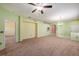 Spacious living room featuring neutral walls, carpet flooring, and ample natural light at 1914 Sassafras Dr, Wesley Chapel, FL 33543