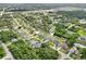 Aerial view of a neighborhood situated on canals with lush greenery and scattered houses at 200 Eppinger Dr, Port Charlotte, FL 33953