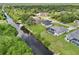 Backyard canal view of a single Gathering home with a screened lanai and direct canal access at 200 Eppinger Dr, Port Charlotte, FL 33953