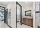 Open plan bathroom with granite countertop, dark wood cabinets, and tiled shower at 200 Eppinger Dr, Port Charlotte, FL 33953