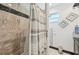 Bathroom with stylish tiling, shower curtain, and window offering natural light at 200 Eppinger Dr, Port Charlotte, FL 33953
