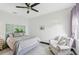 Well-lit bedroom with a queen-size bed, ceiling fan, and tiled floors at 200 Eppinger Dr, Port Charlotte, FL 33953