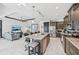Modern kitchen with an island, stainless steel appliances, and seamless flow into the open living space at 200 Eppinger Dr, Port Charlotte, FL 33953