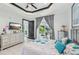Bright main bedroom features tray ceiling, patio access, and dresser with television at 200 Eppinger Dr, Port Charlotte, FL 33953