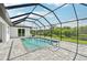 Screened in pool with paved patio area and views of backyard at 200 Eppinger Dr, Port Charlotte, FL 33953