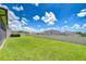 Expansive fenced backyard, perfect for outdoor activities and relaxation under the sunny sky at 208 English Heritage Pl, Dover, FL 33527