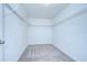 Walk-in closet with ample metal shelving for organized storage at 208 English Heritage Pl, Dover, FL 33527