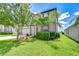 Well-maintained two-story home with lush landscaping and a spacious two-car garage at 208 English Heritage Pl, Dover, FL 33527
