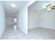 Hallway featuring tile floors and a ceiling fan at 208 English Heritage Pl, Dover, FL 33527