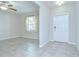 Living room featuring tile floors, a ceiling fan, and a window with blinds at 208 English Heritage Pl, Dover, FL 33527