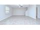 Living room featuring tile floors, stairs, a ceiling fan, and a window with blinds at 208 English Heritage Pl, Dover, FL 33527