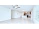 Open-concept living space featuring tile floors, kitchen with modern appliances at 208 English Heritage Pl, Dover, FL 33527