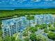 Aerial view showcasing the community's prime waterfront location, with lush landscaping and scenic ocean views at 2333 Feather Sound Dr # B609, Clearwater, FL 33762