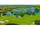 Overhead view of the community near a golf course, featuring a pond and various residential buildings at 2333 Feather Sound Dr # B609, Clearwater, FL 33762