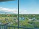 Beautiful balcony view featuring lush landscaping, serene ponds, and ample parking at 2333 Feather Sound Dr # B609, Clearwater, FL 33762