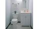 Compact bathroom with a toilet and vanity offering a functional space, adorned with white fixtures at 2333 Feather Sound Dr # B609, Clearwater, FL 33762