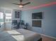 Modern bedroom featuring cool blue walls, workspace, and large windows for natural light at 2333 Feather Sound Dr # B609, Clearwater, FL 33762