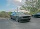 A modern gray Dodge Challenger parked in a designated parking space at 2333 Feather Sound Dr # B609, Clearwater, FL 33762