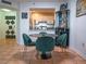 Dining area looking into the kitchen with tile floors and modern furnishings at 2333 Feather Sound Dr # B609, Clearwater, FL 33762