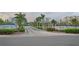 Crystal Bay entrance featuring lush landscaping, prominent signage, and well-maintained roadways at 2333 Feather Sound Dr # B609, Clearwater, FL 33762