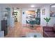 Open living room featuring a bar, kitchen view, and stylish dining set at 2333 Feather Sound Dr # B609, Clearwater, FL 33762