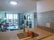 Open concept living space with tile floors, dining area, balcony and comfortable seating at 2333 Feather Sound Dr # B609, Clearwater, FL 33762