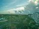 Beautiful view from the property featuring lush greenery, water features, and community buildings at 2333 Feather Sound Dr # B609, Clearwater, FL 33762
