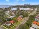 Stunning aerial view showcasing a waterfront community with beautiful homes, lush greenery, and city skyline backdrop at 243 Snell Isle Ne Blvd, St Petersburg, FL 33704