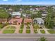 Beautiful aerial view of homes, manicured lawns, and lush greenery near the water at 243 Snell Isle Ne Blvd, St Petersburg, FL 33704