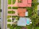 Aerial view of a home featuring a circular driveway, lush landscaping, pool and an outlined property at 243 Snell Isle Ne Blvd, St Petersburg, FL 33704