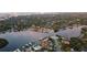 Aerial view showcasing waterfront community, boat docks and marina with the Tampa skyline visible on the horizon at 243 Snell Isle Ne Blvd, St Petersburg, FL 33704