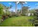 Expansive backyard with a well-maintained lawn, privacy fence, and plenty of space for recreation and gardening at 243 Snell Isle Ne Blvd, St Petersburg, FL 33704