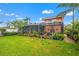 Lush backyard featuring a screened-in porch and beautiful green lawn at 243 Snell Isle Ne Blvd, St Petersburg, FL 33704