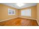 Bright bedroom boasting hardwood floors, neutral walls, and windows fitted with white shutters at 243 Snell Isle Ne Blvd, St Petersburg, FL 33704