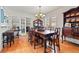 Formal dining room featuring wood floors, a chandelier, and a dining table set for eight at 243 Snell Isle Ne Blvd, St Petersburg, FL 33704