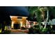 Charming two-story home featuring a brick driveway, well-lit facade, and mature landscaping at 243 Snell Isle Ne Blvd, St Petersburg, FL 33704