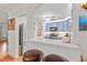 Contemporary kitchen with stainless steel appliances, a breakfast bar with stools, and lots of natural light at 243 Snell Isle Ne Blvd, St Petersburg, FL 33704