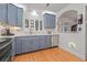 Bright kitchen with stainless steel appliances, white countertops, blue cabinets, and a window offering natural light at 243 Snell Isle Ne Blvd, St Petersburg, FL 33704