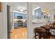 Modern kitchen with stainless steel appliances, stylish cabinets, a breakfast bar with stools, and hardwood flooring at 243 Snell Isle Ne Blvd, St Petersburg, FL 33704