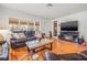 Spacious living room featuring a leather sofa, hardwood floors, and plenty of natural light at 243 Snell Isle Ne Blvd, St Petersburg, FL 33704