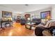 Cozy living room with hardwood floors, two sofas, and a dining room set at 243 Snell Isle Ne Blvd, St Petersburg, FL 33704