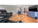 Cozy living room with hardwood floors, a large television, a cabinet and lots of natural light at 243 Snell Isle Ne Blvd, St Petersburg, FL 33704