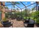 Inviting screened patio featuring brick pavers and comfortable seating, perfect for enjoying the outdoor view at 243 Snell Isle Ne Blvd, St Petersburg, FL 33704