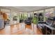 Bright sunroom with hardwood floors, floor-to-ceiling windows, and comfortable seating, perfect for relaxation at 243 Snell Isle Ne Blvd, St Petersburg, FL 33704