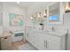 Bright bathroom featuring double vanity, soaking tub, decorative art, and stylish lighting at 271 Monet Trl, Bradenton, FL 34212