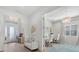 Elegant foyer with a chandelier, white walls, and a view into a bright, well-lit office space at 271 Monet Trl, Bradenton, FL 34212