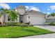 Beautiful one-story home with a two-car garage and luscious, green landscaping at 271 Monet Trl, Bradenton, FL 34212